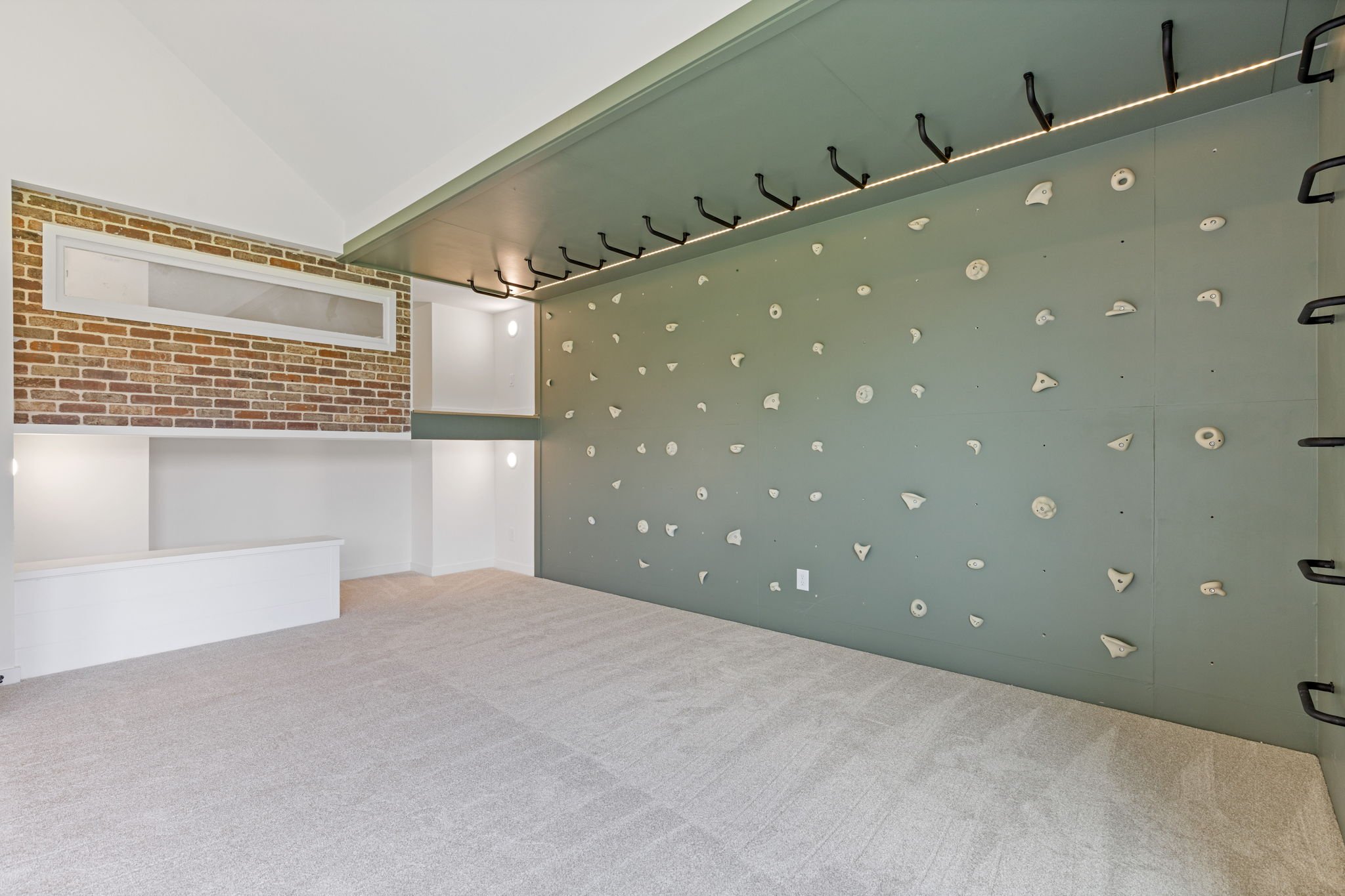 Custom climbing wall and bunk room