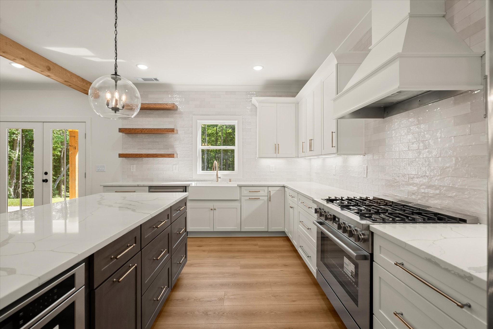 Forest and Stone — kitchen with dark island and zellige tile
