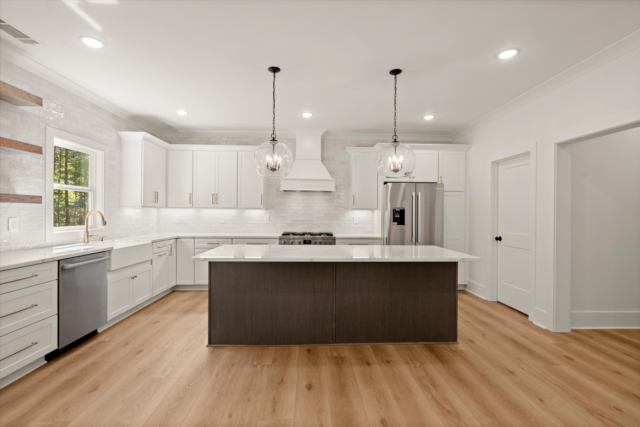 Forest and Stone — kitchen wide view with globe pendants
