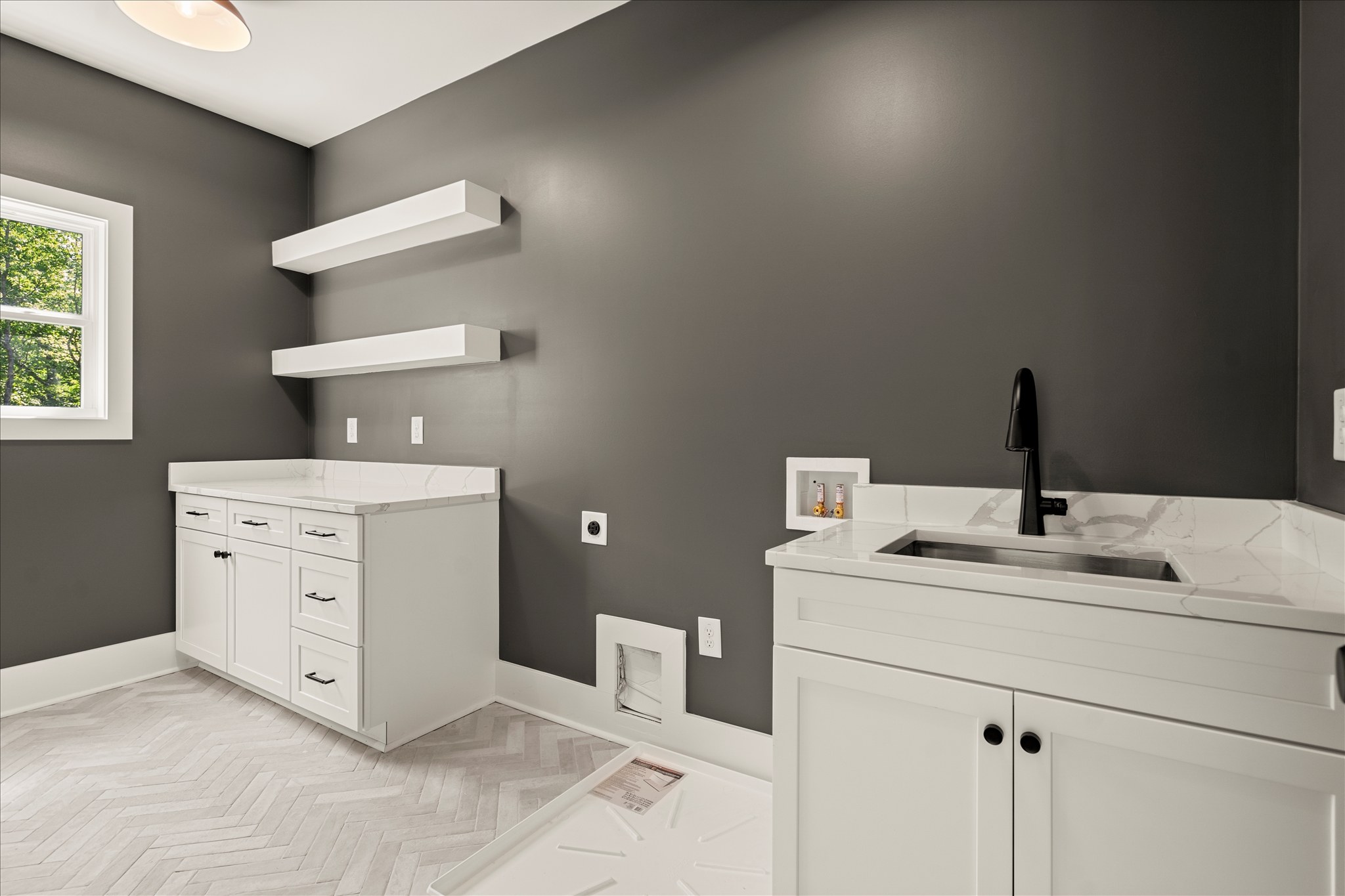 Forest and Stone — laundry room with herringbone tile