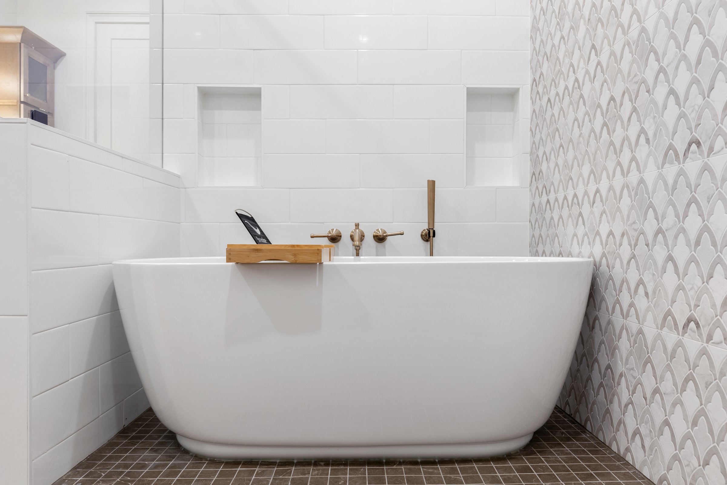 Primary bath detail — soaking tub and scallop tile